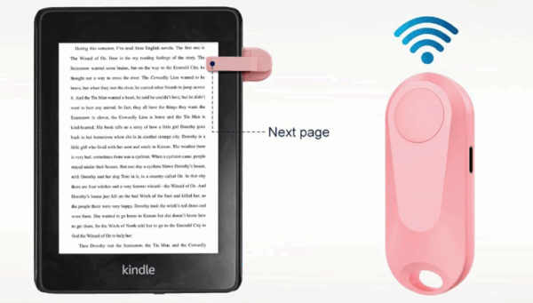 A pink remote and receiver for page turning. The page turner clips to the side of a device, and the remote control is about the size of a finger but twice as wide.