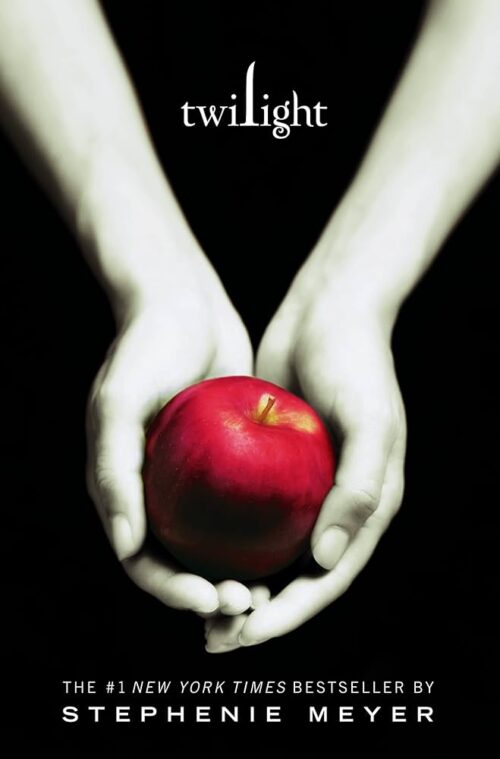 The original twilight cover with two very pale arms holding an apple against a black background