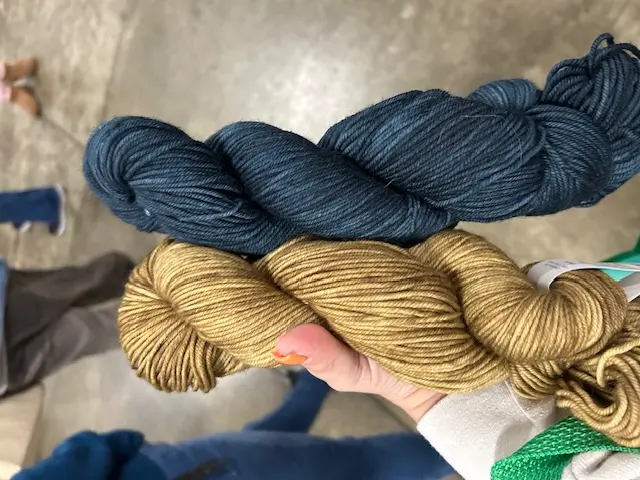 gold and blue skeins of yarns