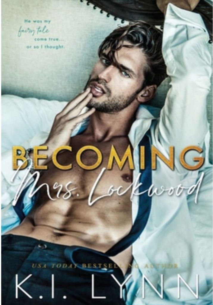 Becoming Mrs Lockwood by K.I. Lynn. A floppy haired man leans back on a couch with his white button-down shirt wide open and his tie untied. He has his hands at his mouth, kind of dragging his bottom lip down.