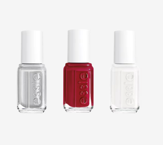Three mini bottles of nail polish in grey, red, and white 