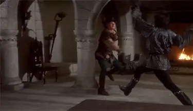 Cary Elwes dodges a sword blow, looks at the camera and says in a deadpan expression, SHOCKING.