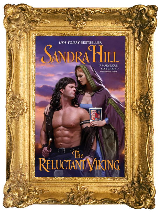 The reluctant viking by Sandra Hill, featuring a shirtless man with a mullet kneeling with his back arched. Behind him is a woman in a dark purple cloak with green trim, and she's holding an SBTB 20th anniversary candle