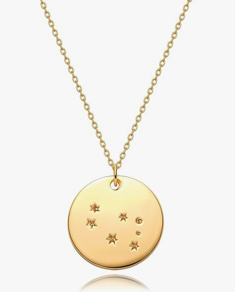 A round charm necklae showing the gemini constellation with a thin chain