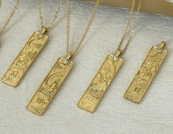 Four gold bar necklaces with tarot cards and zodiac signs 