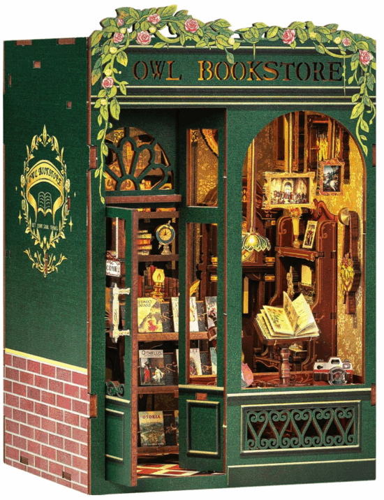 A Miniature 3d puzzle to build an Owl Bookstore - a green bookstore with gold walls and lots of miniature books inside