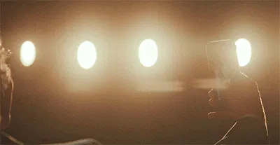 Ilya is taking a selfie with Shane, and the camera is behind them both showing Ilya's hand stroking the back of Shane's neck then down his back, hidden from the selfie