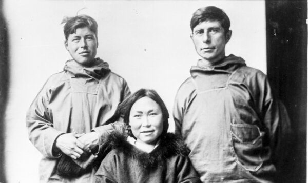 Black and white photo shows Qaavigarsuaq, Arnarulunnguaqin, and Rasmussen in their winter garb.