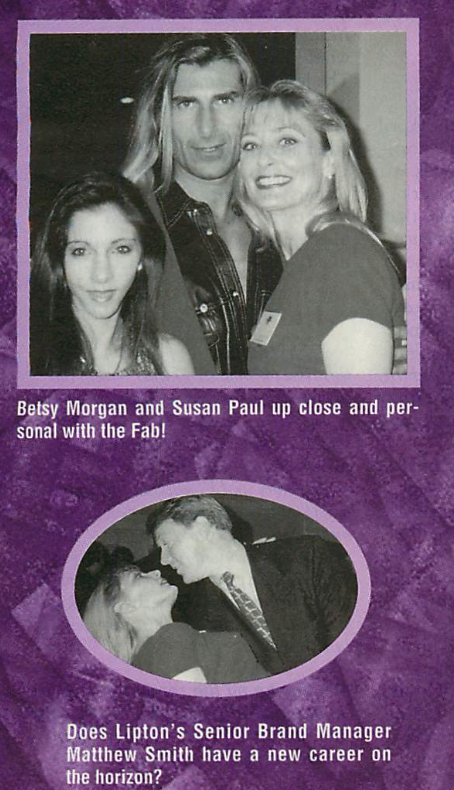 A black and white image from the cover shoot with the male model perched on the edge of a staircase with a blonde long haired model sort of woven between his legs so her head rests right on his chin. The mustache is mustaching.