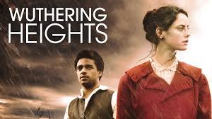 Movie poster for 2011 version of Wuthering Heights shows actor James Howson in white shirt and brown vest standing behind actress Kaya Scodelario in a white dress and red coat.