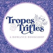 Tropes and Trifles a romance bookstore in a white circle in blue swoopy letters with a purple pattern at the borders