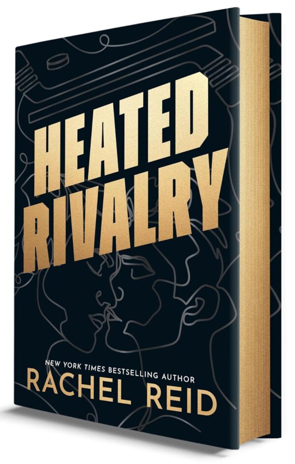 A black hardcover with gold spredges. On the front is HEATED RIVALRY and the author name in gold, with a line drawing of two figures kissing with some lines making hockey sticks above the title. 