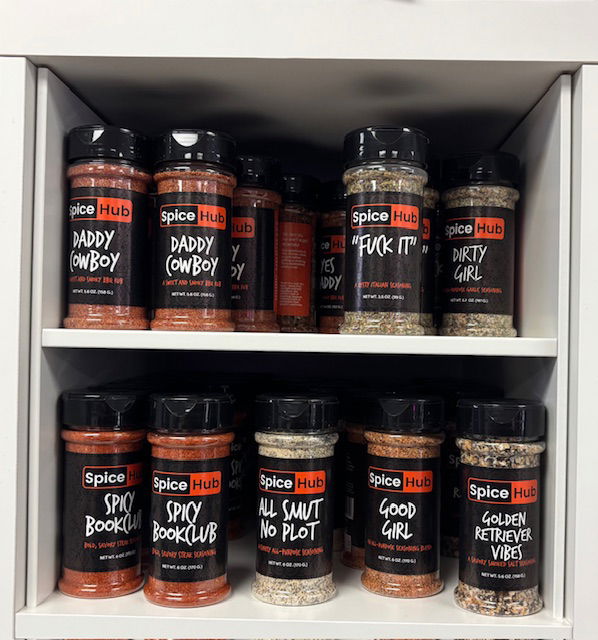 Jars of spices from Spice Hub in flavors like Daddy Cowboy, Fuck it, all smut no plot, good girl, and spicy bookclub