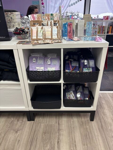 A cart with merch and books