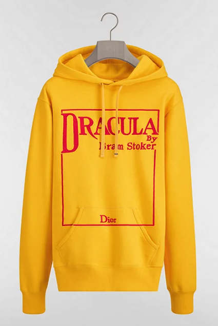 A yellow cotton sweatshirt with the words DRACULA by Bram Stoker at the top of a rectangular red line, with Dior at the bottom