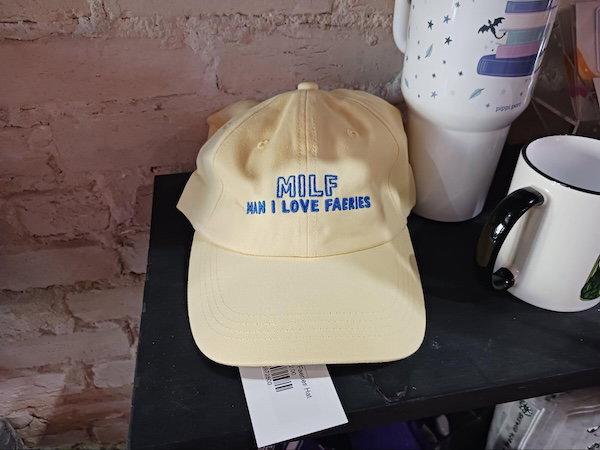 An embroidered yellow ballcap that says in blue MILF: Man I Love Fairies 