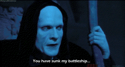 A man in blue makeup wearing a hood and holding a staff says with exasperation you have sunk my battleship