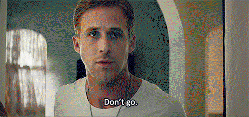 Ryan Gosling stands in a door way in a white t shirt and says don't go