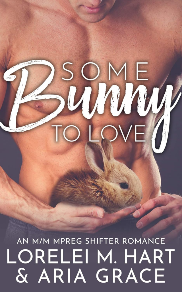 Some Bunny to Love by Lorelei Hart and Aria Grace. A headless shirtless man is holding a photoshopped bunny in his hand, which is coincidentally right as his waistline.