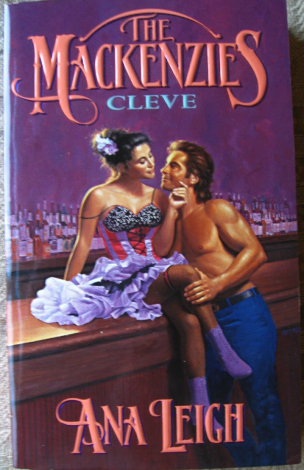 The Mackenzies Cleve by Ana Leigh: a dancer in a purple ruffly dress with flowers in her hair and purple dancing boots is seated on a bar with a full shelf of alcohol behind her. Leaning on the bar with no shirt and jeans is a guy with a mullet and he is just smarming all over her. 