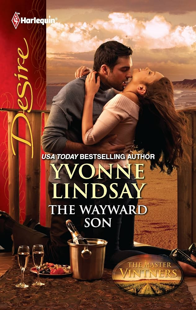 The Wayward Son by Yvonne Lindsay. A man and woman on windy beach. The woman is tipping her head back at a concerning angle. At their feet is an ice bucket of champagne and some fruit. 