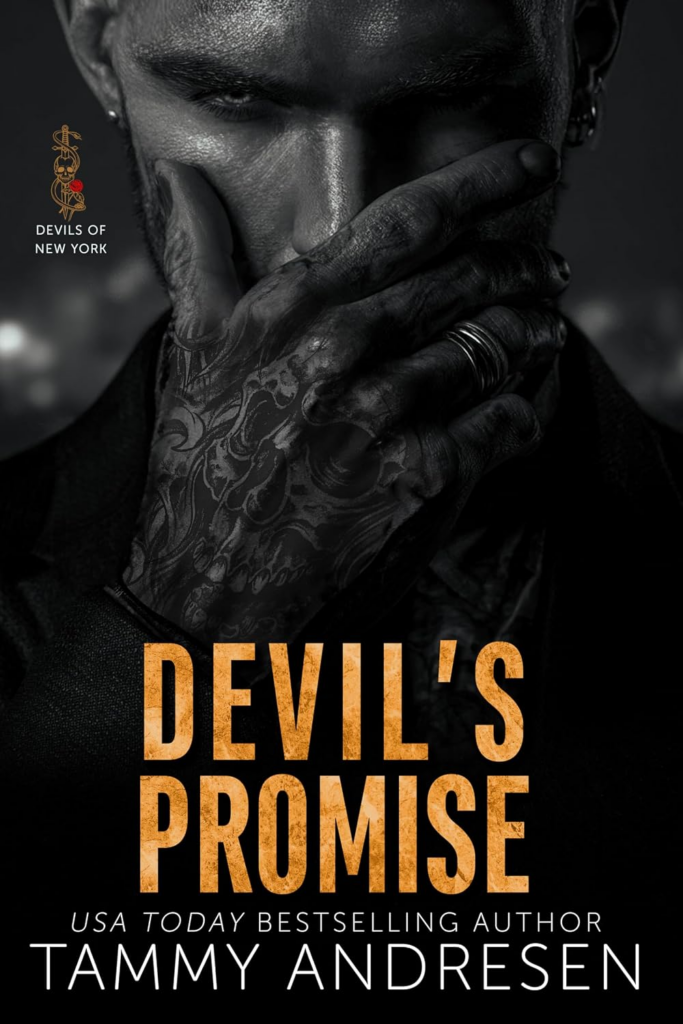 Devil's Promise by Tammy Andrews. A close up photograph of a man's face in black and white. He's covering his nose and mouth with his hand, which is heavily tattooed.