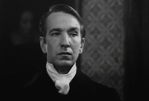 Alan Rickman in a cravat giving the side eye