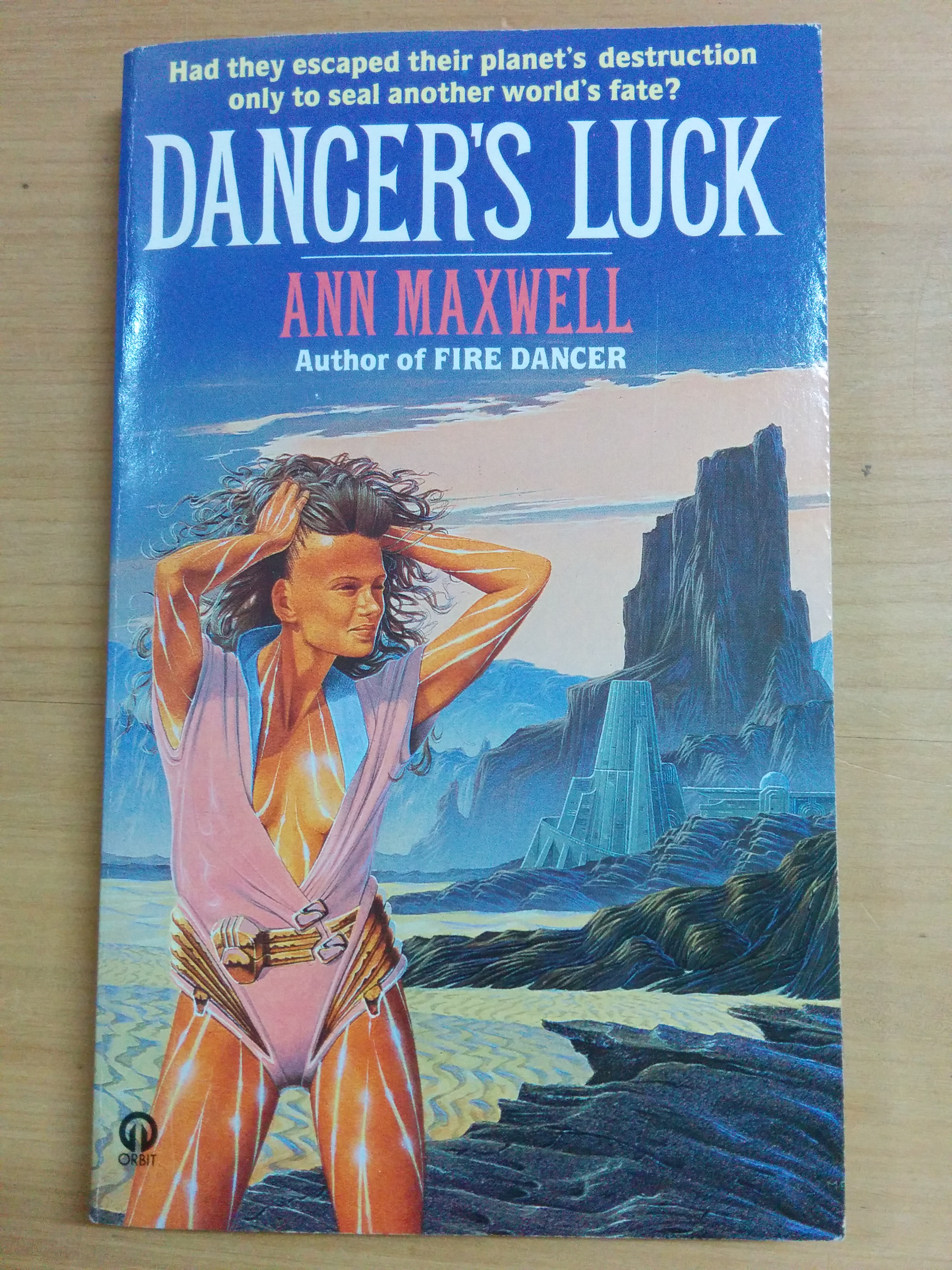 woman holding her hair away from her face except she has no hair so far back from her face that it looks like she's scalping herself