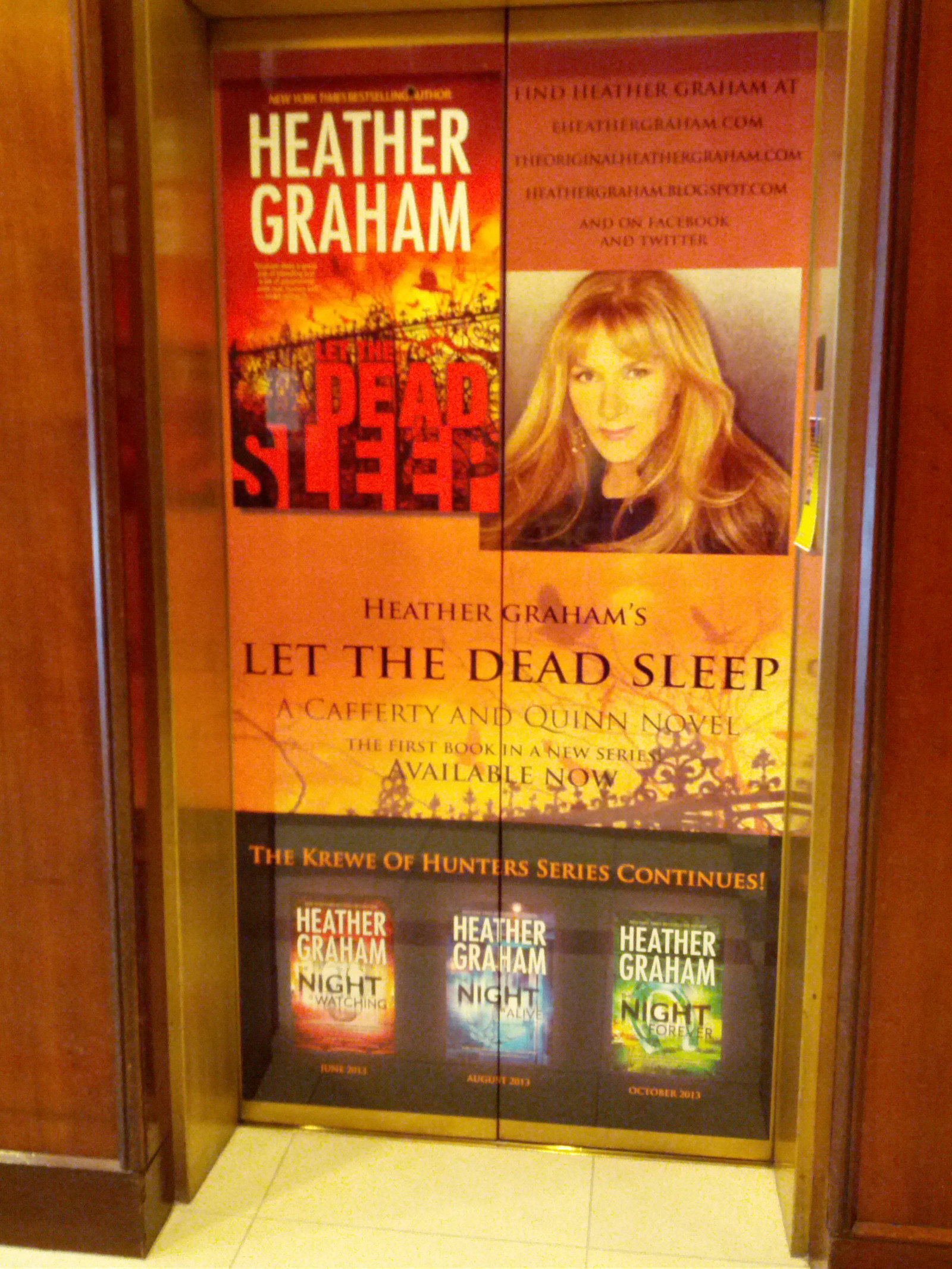 Elevator doors branded with Heather Graham image and books