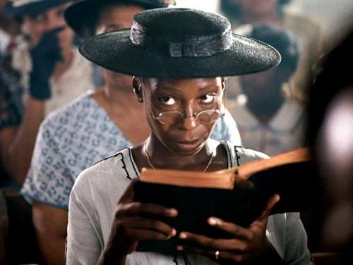 Whoopi Goldberg in The Color Purple, reading and giving someone the side eye