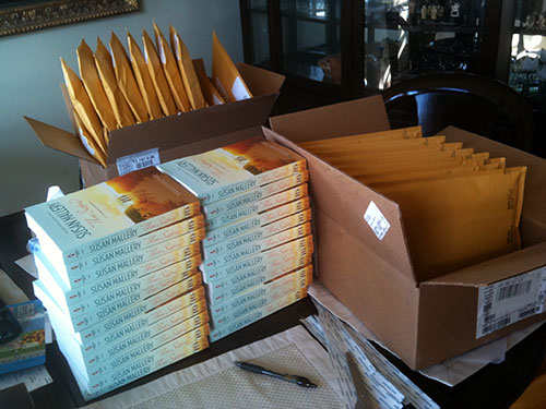 Review Crew mailing - piles and piles of books and mailing envelopes